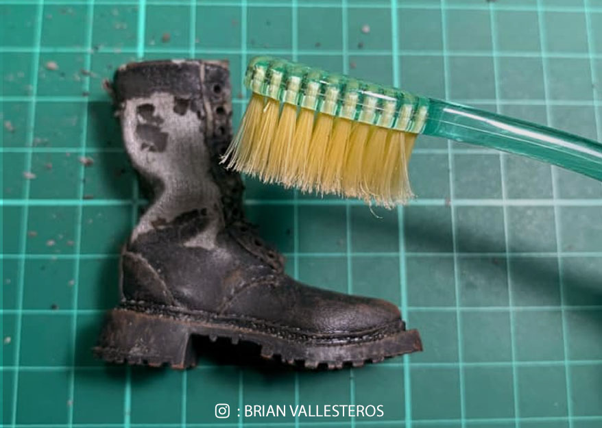 toothbrush used to remove debris from the boots.
